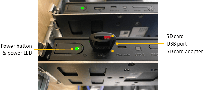 Picture of gateway including power button, power LED, and SD card with adapter